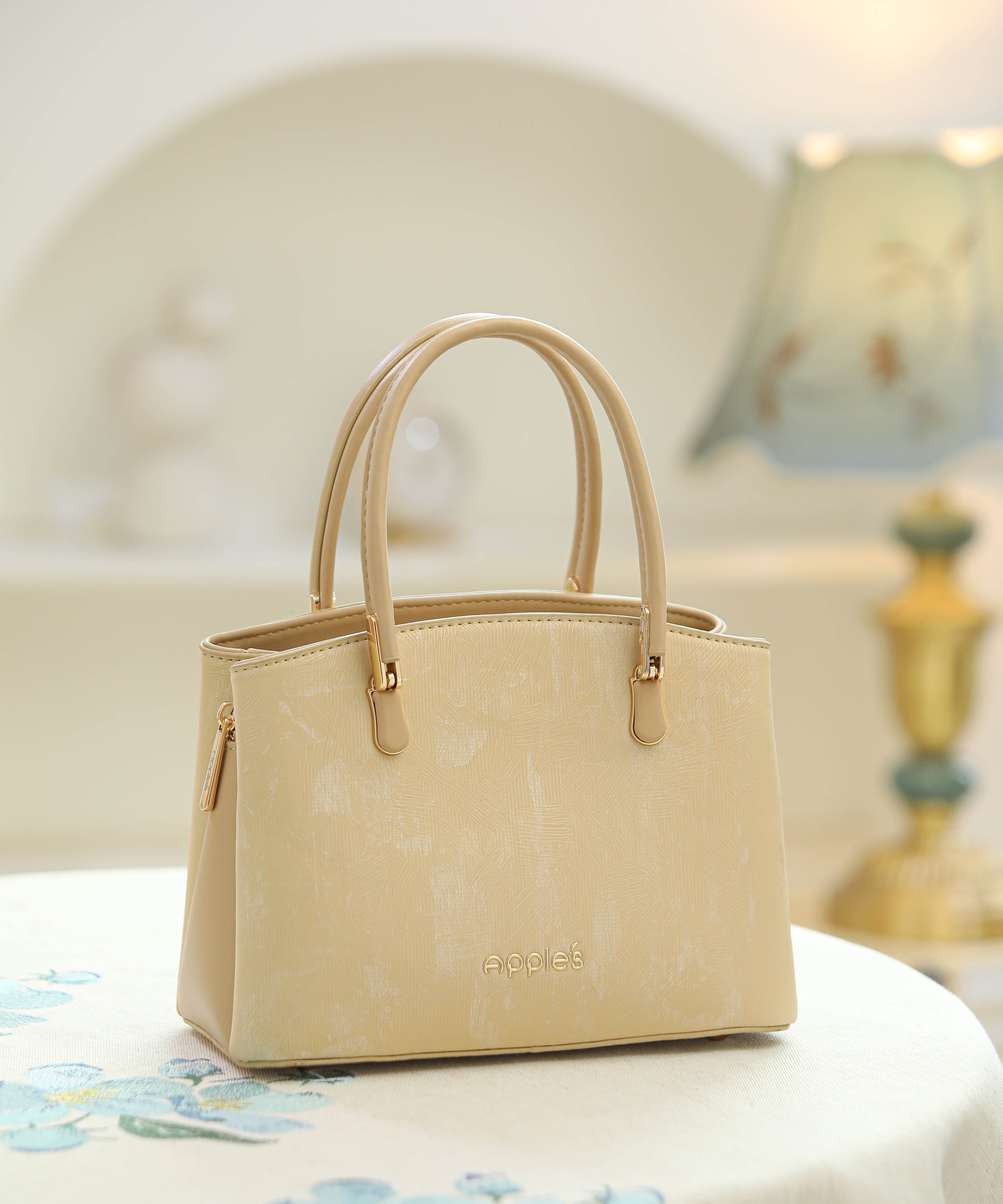 Liora tan structured top handle handbag by Apples UAE - front view