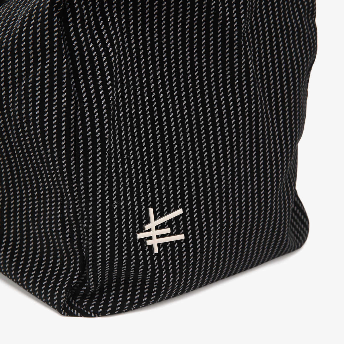 Stride Duffel black structured handbag by Apples UAE - side profile